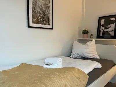 Ein Bett oder Betten in einem Zimmer der Unterkunft OMNI Rooms - Oranienburg