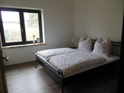 Ein Bett oder Betten in einem Zimmer der Unterkunft Schöne Scheune Lünow