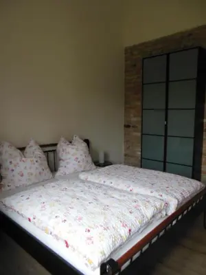 Ein Bett oder Betten in einem Zimmer der Unterkunft Schöne Scheune Lünow