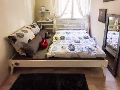 Ein Bett oder Betten in einem Zimmer der Unterkunft Cosy Room in Our Apartment