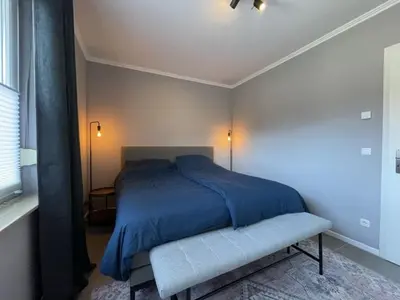 Ein Bett oder Betten in einem Zimmer der Unterkunft Luxus-Domizil am Wasser mit eigenem Bootssteg
