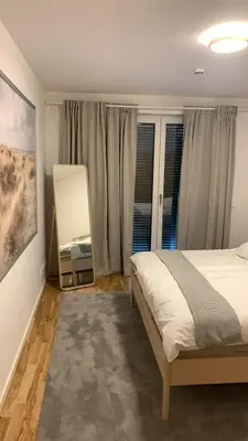 Ein Bett oder Betten in einem Zimmer der Unterkunft Neue stillvolle Wohnung im Steinbach Palais, ideale Lage