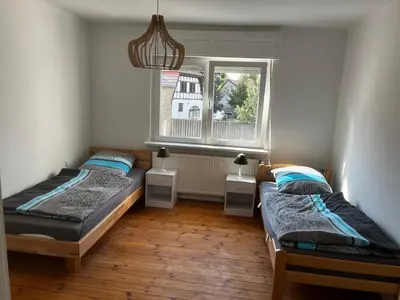 Ein Bett oder Betten in einem Zimmer der Unterkunft Große Monteurwohunung-Fewo