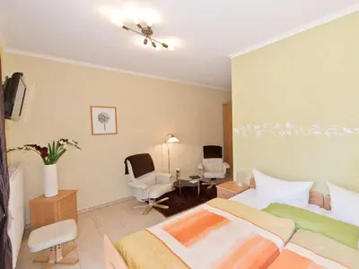 Ein Bett oder Betten in einem Zimmer der Unterkunft Pension am Hasenberg
