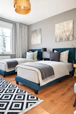 Ein Bett oder Betten in einem Zimmer der Unterkunft Haus Gitta - Wohlfühlen & Genießen