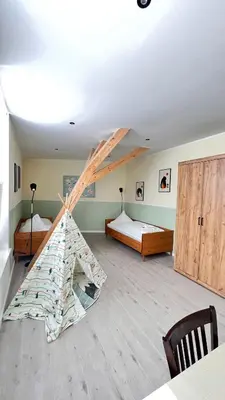 Ein Bett oder Betten in einem Zimmer der Unterkunft New Nomads Ferienwohnung am See