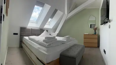 Ein Bett oder Betten in einem Zimmer der Unterkunft New Nomads Ferienwohnung am See