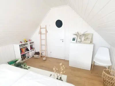 Ein Bett oder Betten in einem Zimmer der Unterkunft Hafenhaus Panoramablick mit Sauna & Whirlpool