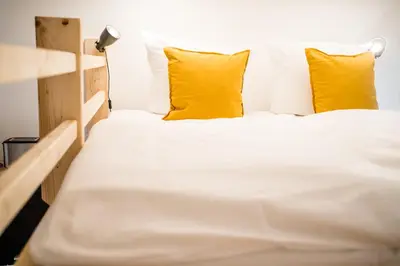 Ein Bett oder Betten in einem Zimmer der Unterkunft Cosy Box for 4 at Boxhagener Platz