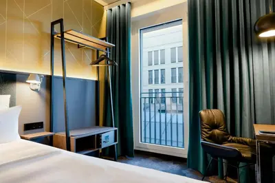 Ein Bett oder Betten in einem Zimmer der Unterkunft Motel One Berlin-Potsdamer Platz
