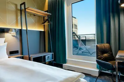 Ein Bett oder Betten in einem Zimmer der Unterkunft Motel One Berlin-Potsdamer Platz