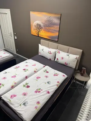 Ein Bett oder Betten in einem Zimmer der Unterkunft Exil DeLuxe