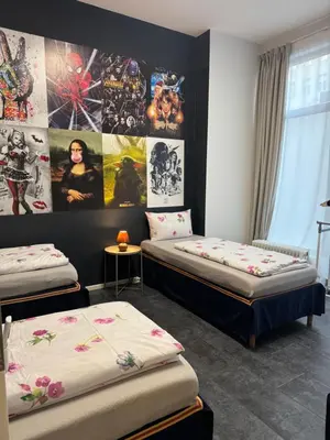 Ein Bett oder Betten in einem Zimmer der Unterkunft Exil DeLuxe