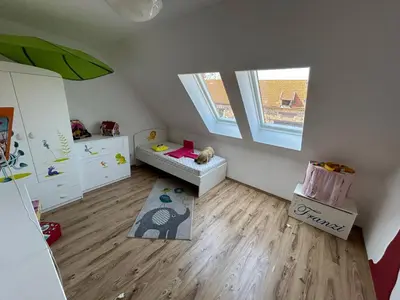 Ein Bett oder Betten in einem Zimmer der Unterkunft Ferienhaus am Beverinsee