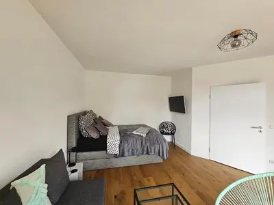 Ein Sitzbereich in der Unterkunft Casa Frida - Business Apartment near Airport BER, kitchen, bathroom, balcony, car park
