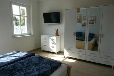 Ein Bett oder Betten in einem Zimmer der Unterkunft Ferienwohnung Sieben Eulen in Garrey (Hoher Fläming)