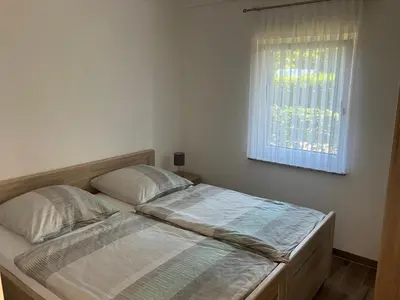 Ein Bett oder Betten in einem Zimmer der Unterkunft Havelstern Ketzin, Ferienhaus Plötze