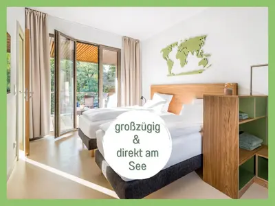 Ein Bett oder Betten in einem Zimmer der Unterkunft 360 Grad by teamgeist Apartmenthaus - familienfreundlich - direkt am See mitten im Naturpark - Wassersportaktivitäten vor Ort
