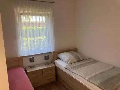 Ein Bett oder Betten in einem Zimmer der Unterkunft Havelstern Ketzin, Ferienhaus Barsch