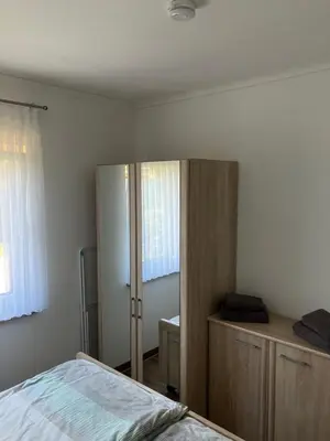 Ein Bett oder Betten in einem Zimmer der Unterkunft Havelstern Ketzin, Ferienhaus Barsch