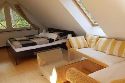 Ein Bett oder Betten in einem Zimmer der Unterkunft Dachwohnung mit Wasserblick und eigenem Bootssteg