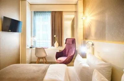 Ein Bett oder Betten in einem Zimmer der Unterkunft Leonardo Hotel Berlin Mitte
