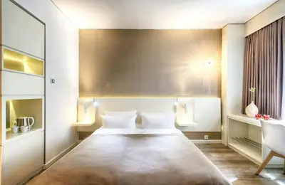 Ein Bett oder Betten in einem Zimmer der Unterkunft Leonardo Hotel Berlin Mitte