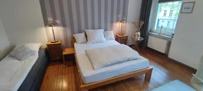 Ein Bett oder Betten in einem Zimmer der Unterkunft Zum Fuchsbau - Schöneiche bei Berlin