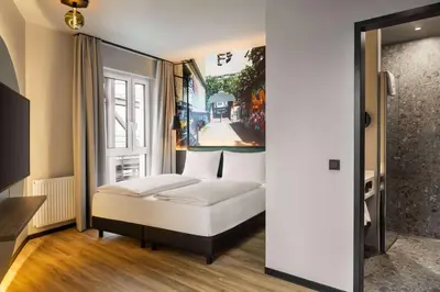 Ein Bett oder Betten in einem Zimmer der Unterkunft Vienna House Easy by Wyndham Berlin Potsdamer Platz