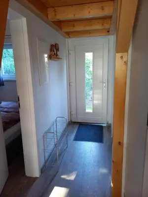 Ein Bett oder Betten in einem Zimmer der Unterkunft NEU! Ferienhaus am See