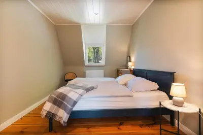 Ein Bett oder Betten in einem Zimmer der Unterkunft Ferienhaus Am Silberberg, Bad Saarow