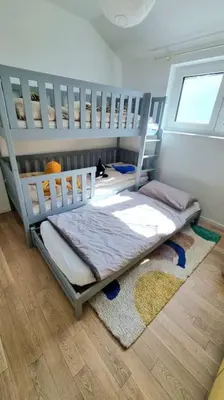 Ein Bett oder Betten in einem Zimmer der Unterkunft Haus am Waldrand und in Seenähe