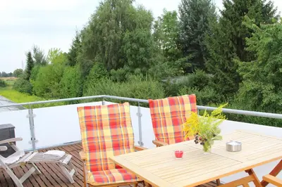 Ein Balkon oder eine Terrasse in der Unterkunft Ferienwohnungen In den Wiesen Oranienburg