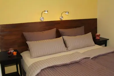 Ein Bett oder Betten in einem Zimmer der Unterkunft Ferienwohnungen In den Wiesen Oranienburg