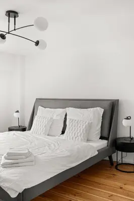 Ein Bett oder Betten in einem Zimmer der Unterkunft Geräumiges Apartment in zentraler Lage Potsdams