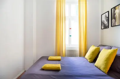 Ein Bett oder Betten in einem Zimmer der Unterkunft Family Apartment in central location