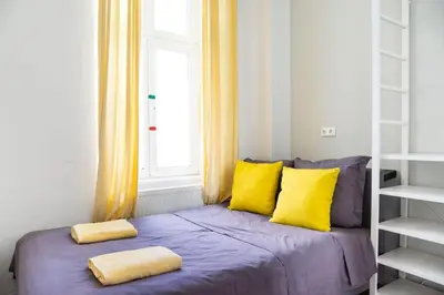 Ein Bett oder Betten in einem Zimmer der Unterkunft Family Apartment in central location