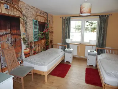 Ein Bett oder Betten in einem Zimmer der Unterkunft Ferienwohnung Zesch am See