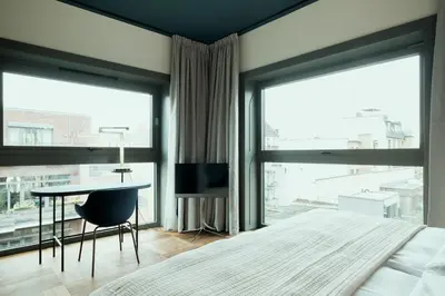 Ein Bett oder Betten in einem Zimmer der Unterkunft The Garden Suites by Suite030
