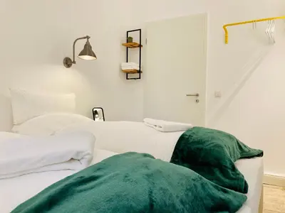 Ein Bett oder Betten in einem Zimmer der Unterkunft Serviced Room im Herzen Berlin‘s