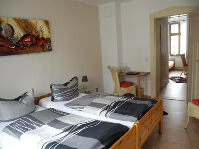 Ein Bett oder Betten in einem Zimmer der Unterkunft Pension La rose