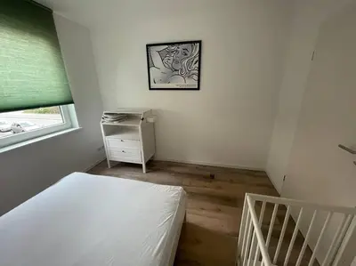 Ein Bett oder Betten in einem Zimmer der Unterkunft Urban house for families and Berlin tourists