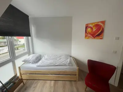 Ein Bett oder Betten in einem Zimmer der Unterkunft Urban house for families and Berlin tourists