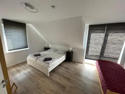 Ein Bett oder Betten in einem Zimmer der Unterkunft Urban house for families and Berlin tourists