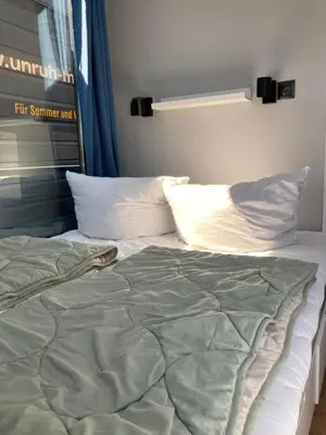 Ein Bett oder Betten in einem Zimmer der Unterkunft Hausboot Celina