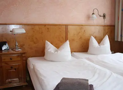 Ein Bett oder Betten in einem Zimmer der Unterkunft Pensionszimmer Unicat