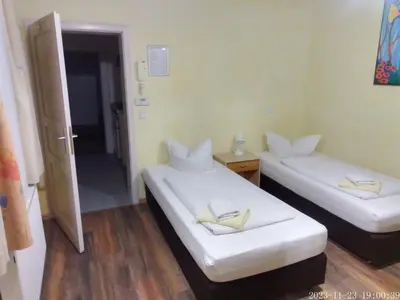 Ein Bett oder Betten in einem Zimmer der Unterkunft Pensionszimmer Unicat