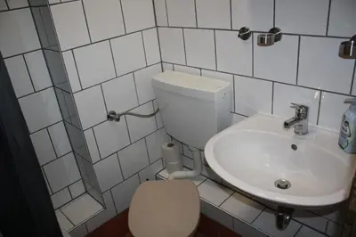 Ein Badezimmer in der Unterkunft Pensionszimmer Unicat