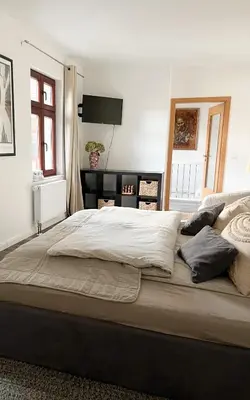 Ein Bett oder Betten in einem Zimmer der Unterkunft Ferienwohnung Kamrath Altstadt