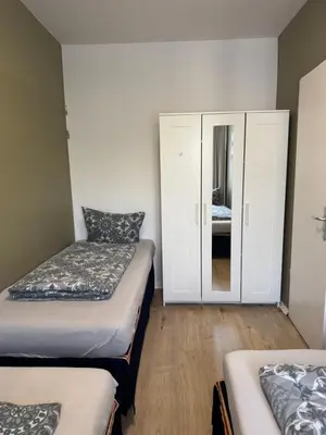 Ein Bett oder Betten in einem Zimmer der Unterkunft Enjoy Berlin